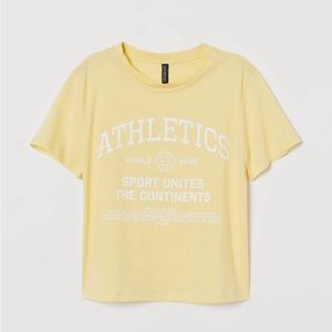 H&M yellow baby tee. Size medium. Super cute with jeans. Perfect length.